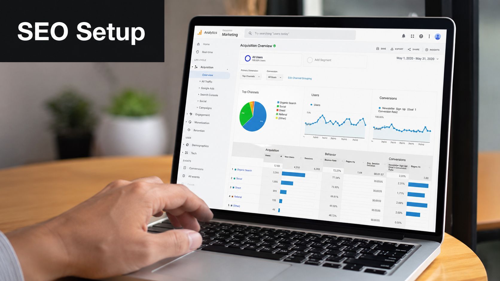 A person using a laptop to analyze website acquisition data on a Google Analytics dashboard for SEO.